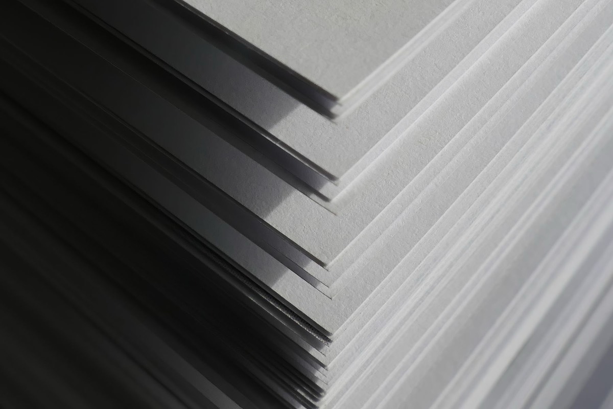 The corner of a stack of paper sheets, layer upon layer